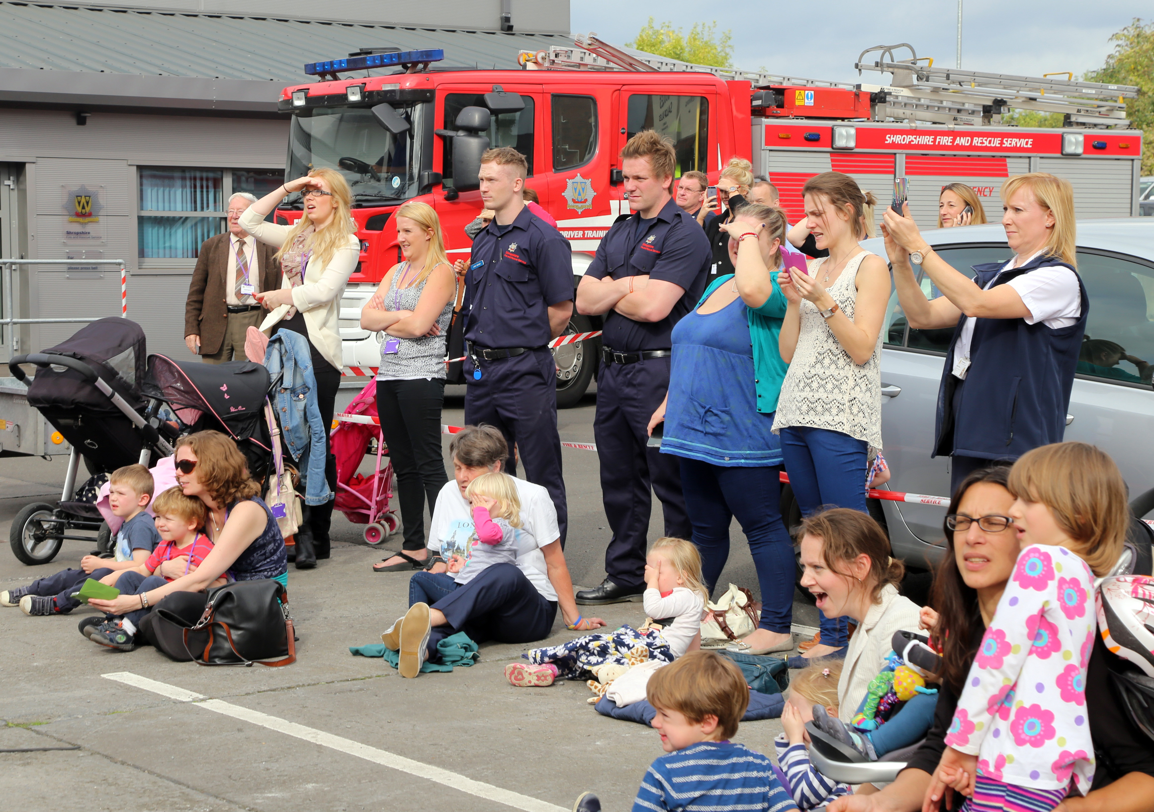 Everyone is safely behind the line to watch the eye catching chip pan fire demonstration.
