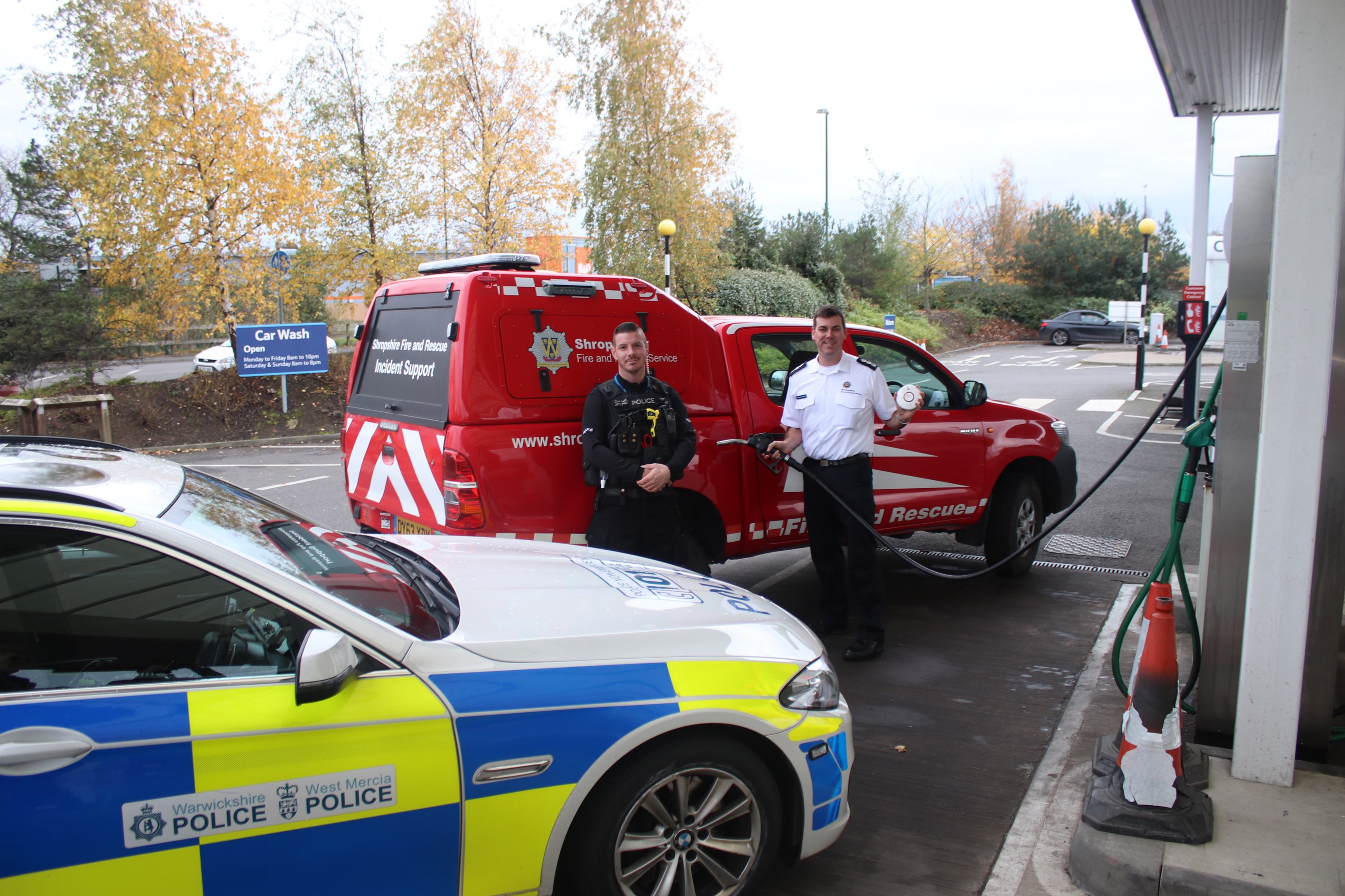 Station Manager James Bainbridge and PC Richard Bramwell launch a joint fire and police safety awareness campaign at the petrol pumps as part of Road Safety Week 2017