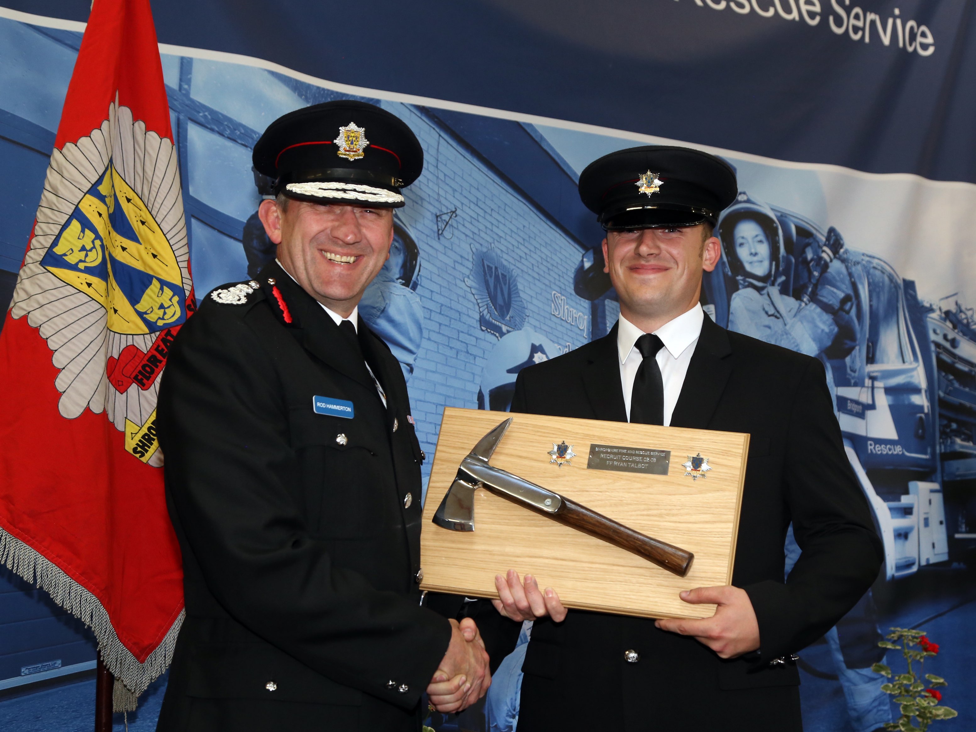 Telford firefighter Ryan Talbot receives the Silver Axe award for top student from Chief Fire Officer Rod Hammerton