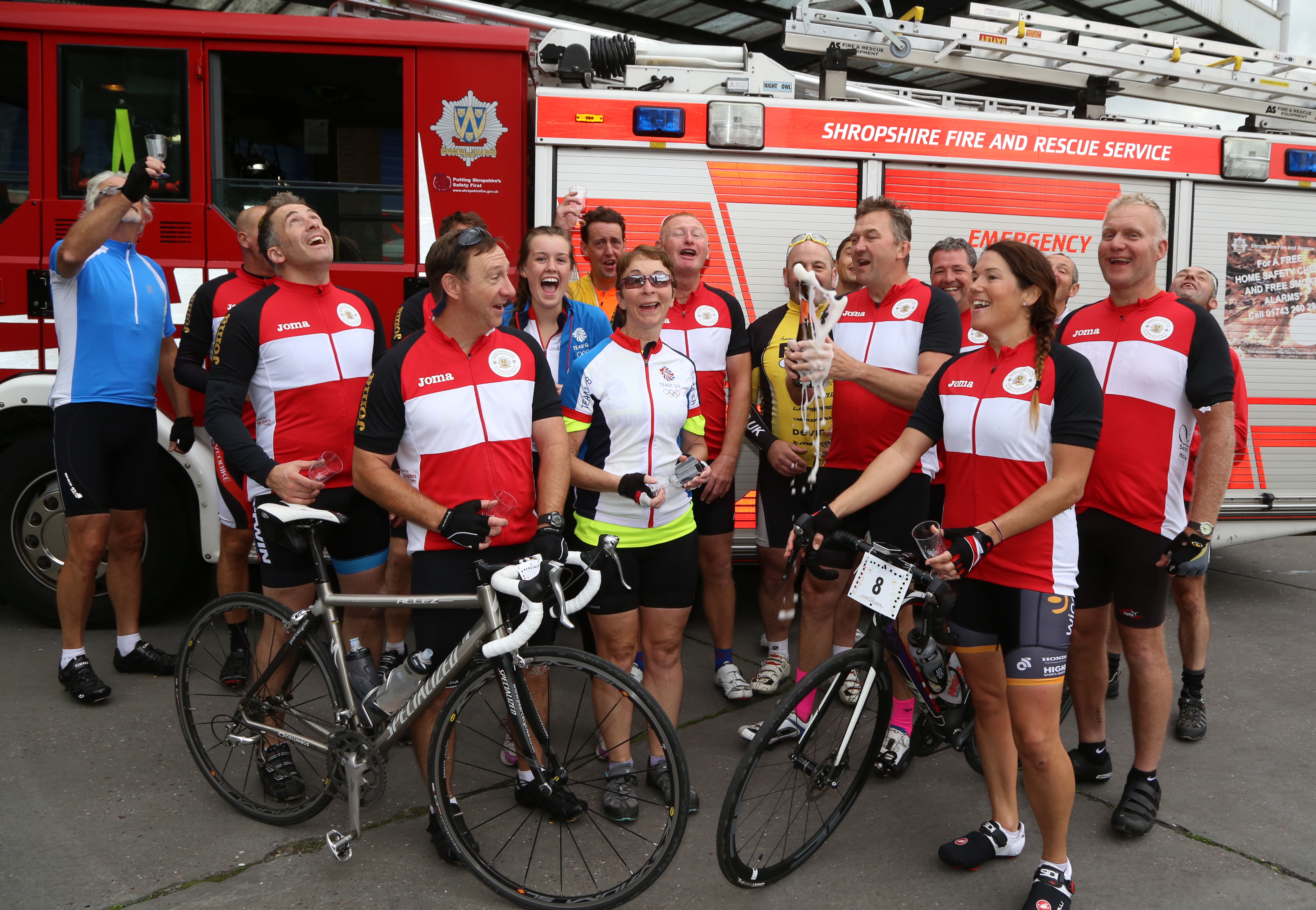 Champagne corks popped at the end of a marathon three day charity cycle ride in aid of The Severn Hospice and the Fire Fighters Charity by members of Shropshire Fire and Rescue Service.