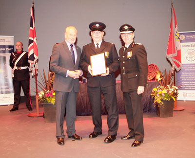 David Warwick receiving award from Stuart West and Paul Raymond