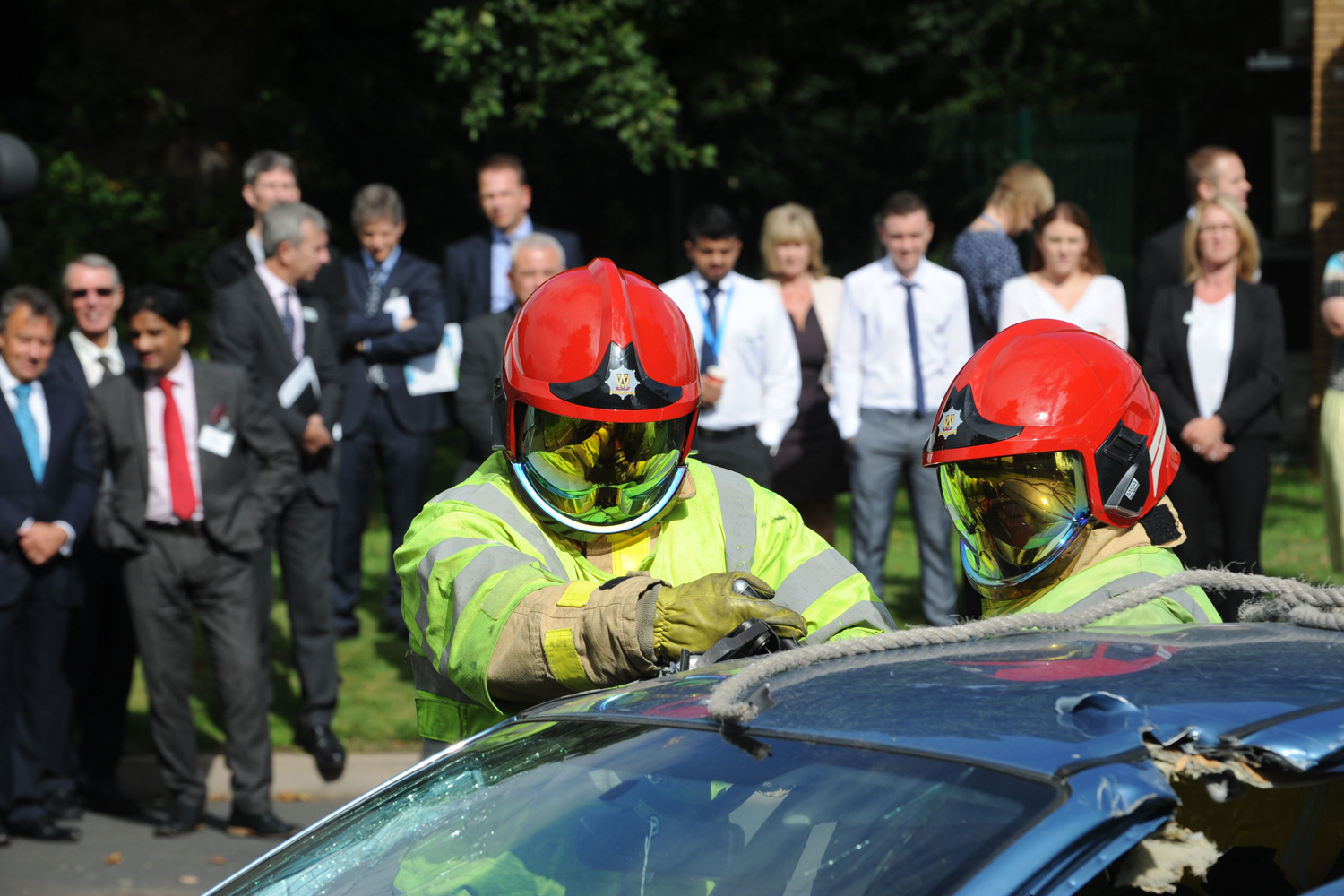 Lord Digby Jones with left to right Shropshire Chief Fire Officer John Redmond and TTC Group Road Safety Director Alan Prosser with firefighters after a car extrication demo as part of the business driver road safety campaign. 