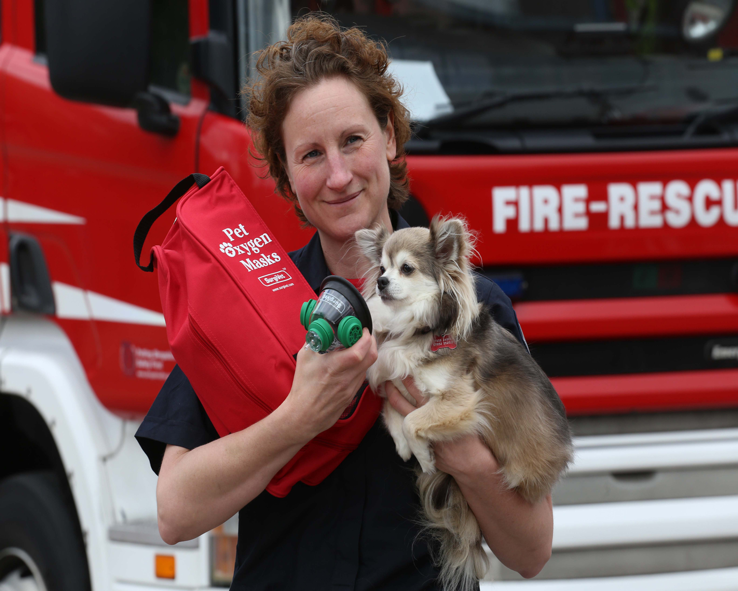 Telford firefighter Louise Fletcher with her pet Chihuahua, Cloud, raised funds to buy five of the masks.