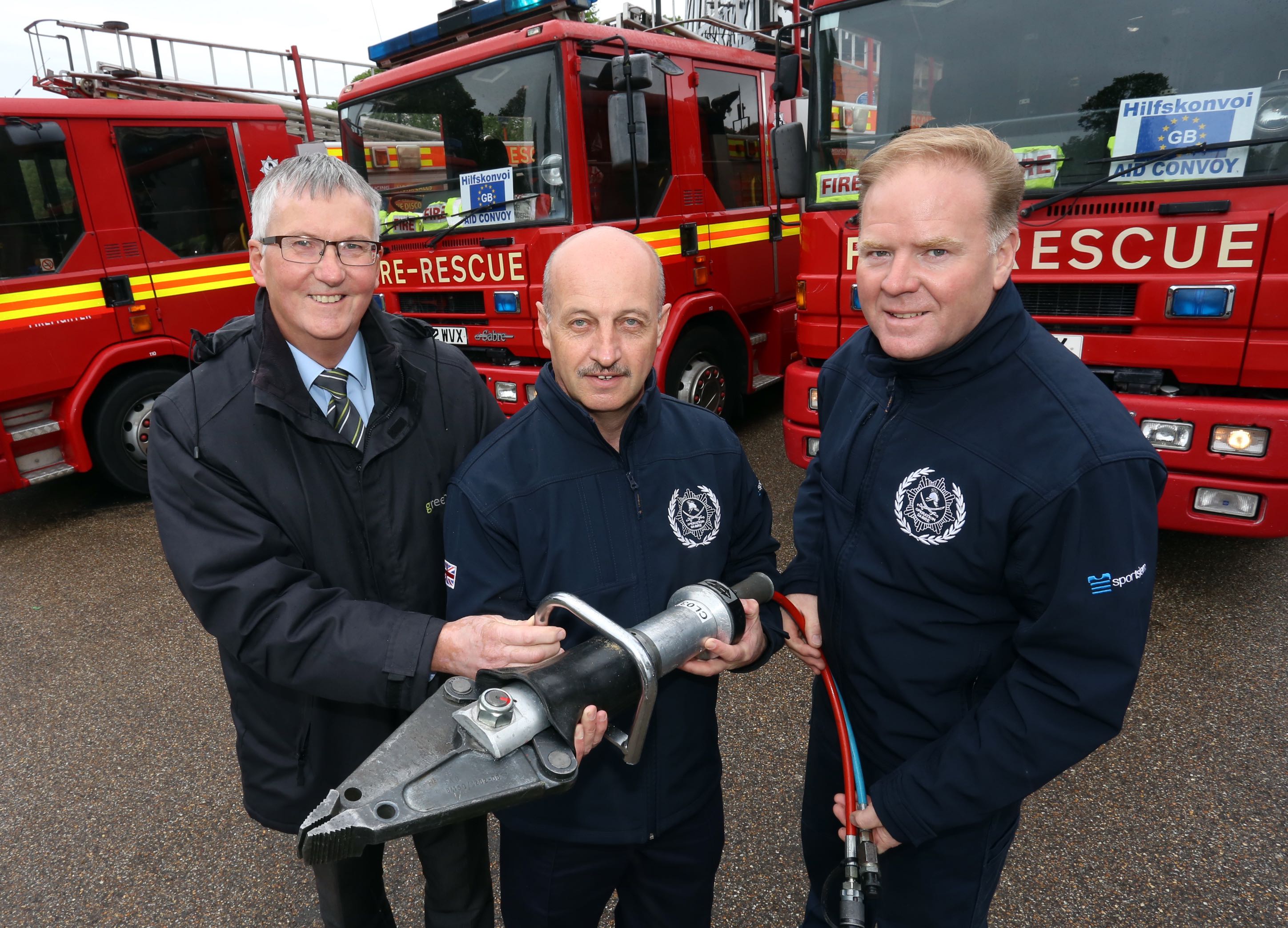 Martin James, (left) of Greenhous, Shrewsbury presents Steve Worrall, with the cutting equipment, pictured with Malcolm Price, a retired firefighter and former member of Shropshire and Wrekin Fire Authority.
