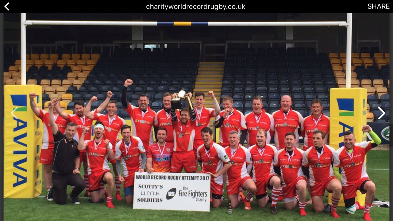 Bridgnorth firefighter Luke Veal (in green sleeves) at the end of the 30 hour world beating rugby challenge for charity