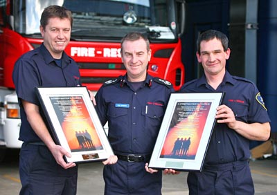 Chief Fire Officer Paul Raymond with firefighters John Bee and Richard Glazier and their awards