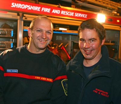 Firefighters Russell Goodwin and Shaun Groves pose in front of appliance