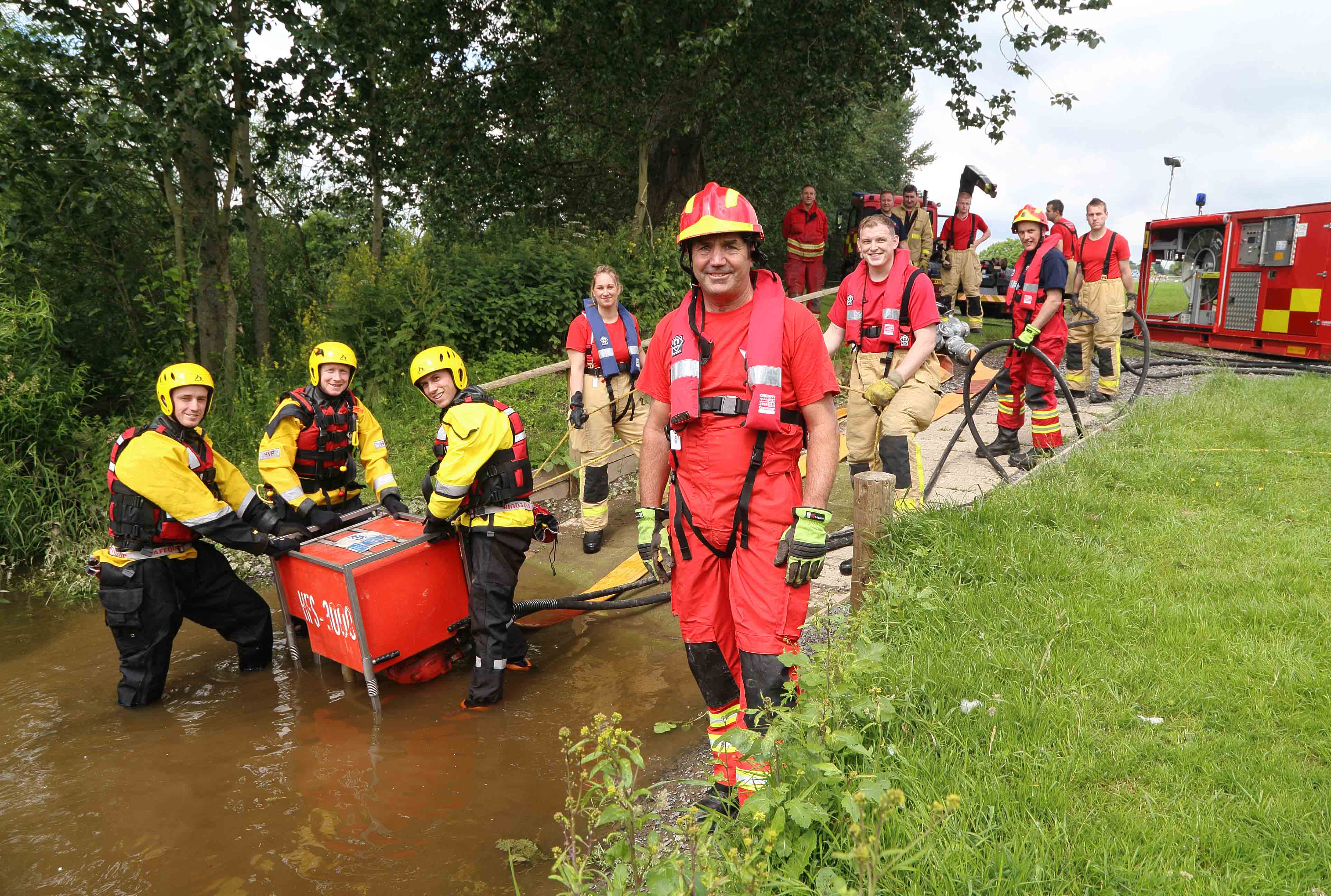 Tactical advisor Mac Harris with firefighters at the West Midlands showground by the River Severn in Shrewsbury, in training for the next floods disaster