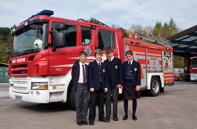 Pupils standing in front of fire appliance