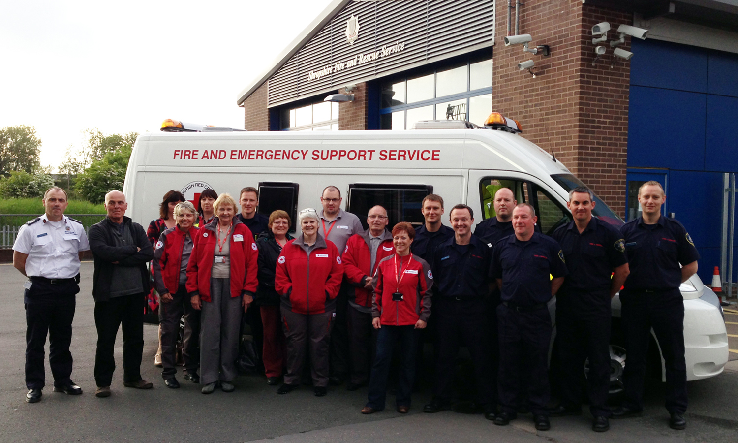 Volunteers with members of White Watch Shrewsbury and (far left) Chief Fire Officer John Redmond and Red Cross operations director Andrew Strong.