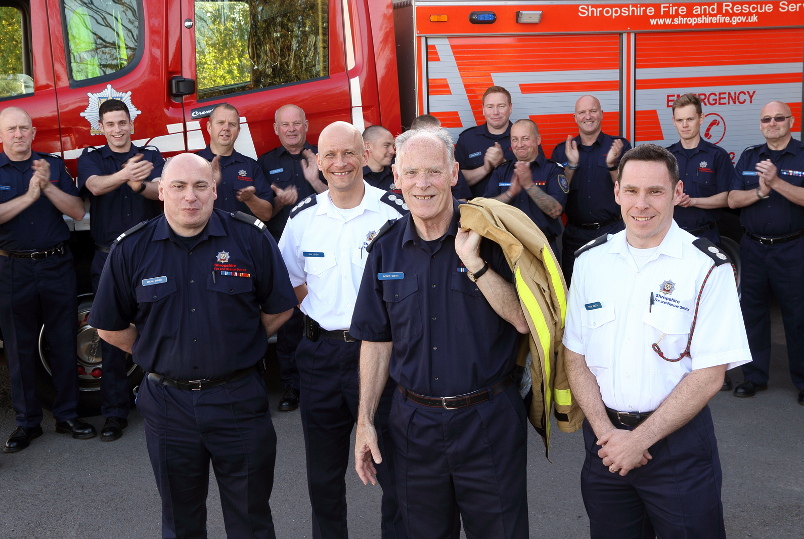 Market Drayton firefighters applaud Roger's long career. Pictured with sons Mark (left) and Paul (right)