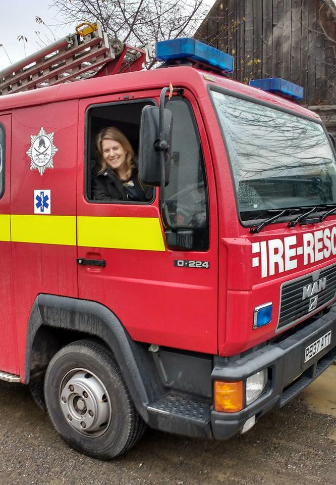 Alex Gregory, the British Embassy representative in Romania, aboard the UK replacement fire appliance