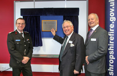 Paul Raymond, Bob Neill MP and Stuart West pose in front of unveiled plaque