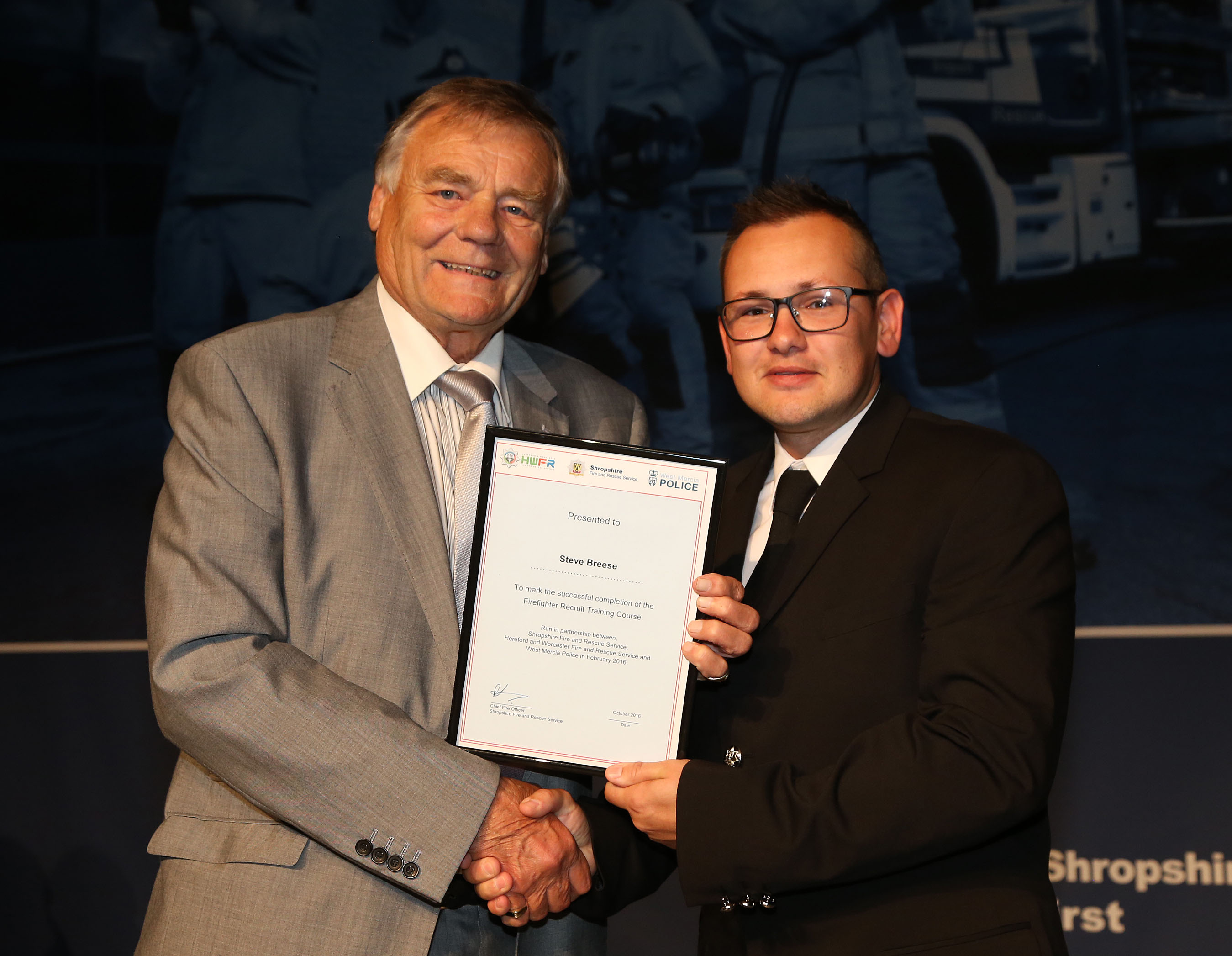Albrighton PCSO Steve Breese won the top student award for his firefighter training course. He is pictured with Councillor Eric Carter.