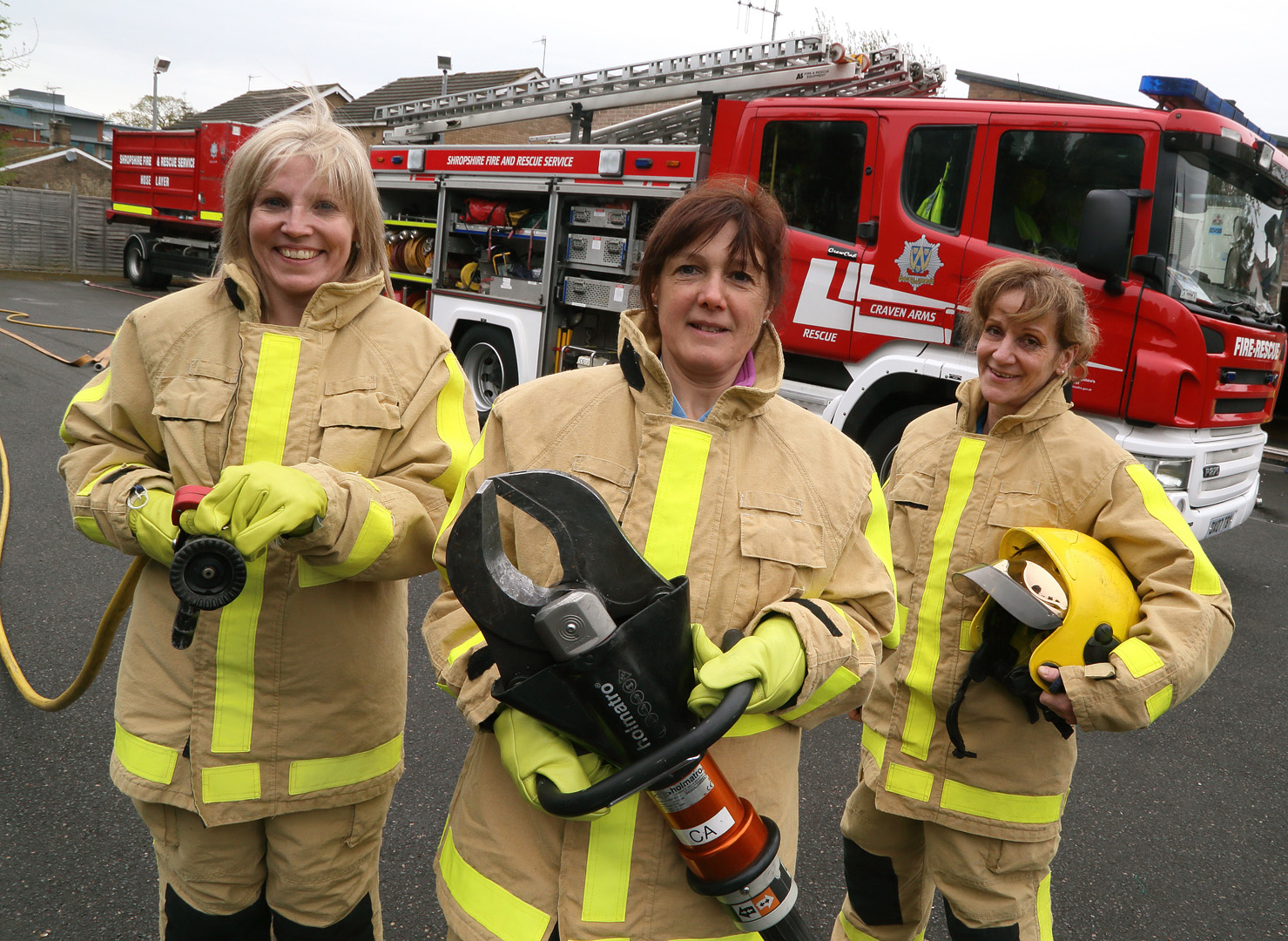 Sally Mawhinney (centre) holds cutting gear used to free people trapped in their vehicles with Tracey Keene (left) and Sylvie Harley (right)