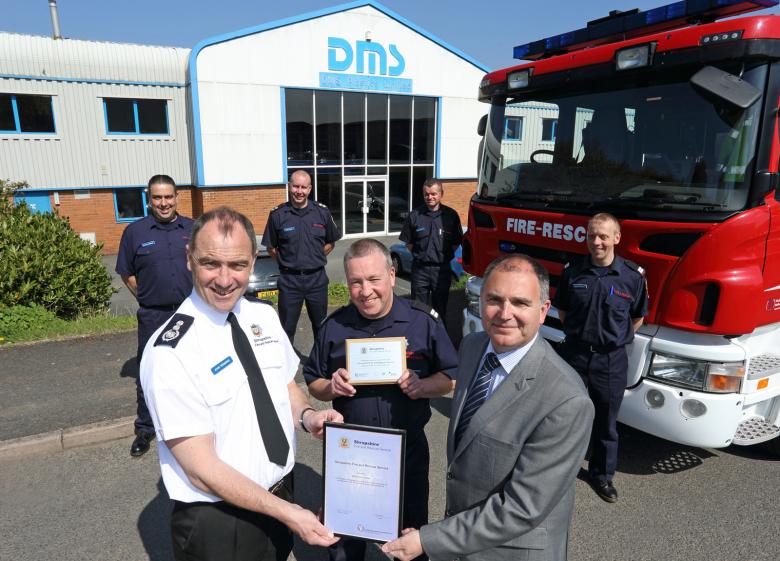 Chief Fire Officer John Redmond presents a certificate and plaque to Ludlow mayor Paul Draper, General Manager at DMS Plastics, for the company’s 25 year support for on call firefighters. He is pictured with firefighter James Bond and colleagues, l to r, Shaun Harrison, Watch Manager Dale Pound, Jason Norgrove and Mark Nicholas.