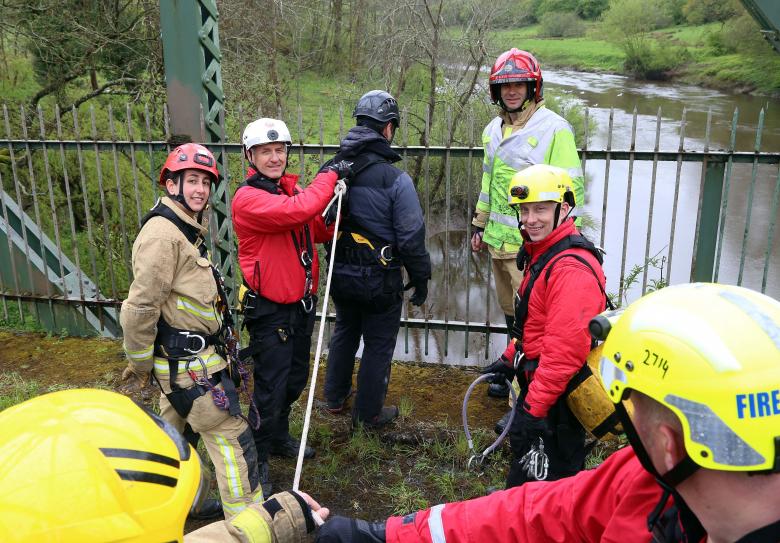 Firefighters from Shropshire Fire and Rescue Service and Hereford and Worcester Fire and Rescue Service prepare to hook up a police negotiator in a training exercise on a bridge over the River Severn. Left to right Telford firefighter Jordan Bixley, Saul Bolton and right, Telford Crew Manager Dave Joiner and Jamie Skipworth.
