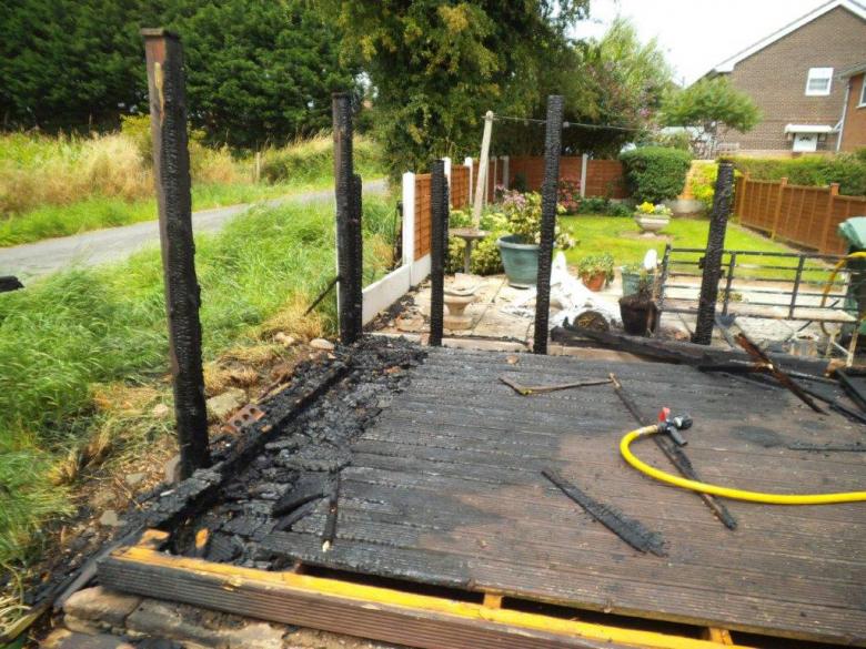 A pensioner suffered smoke inhalation when using a hosepipe to fight a fire in her garden caused by a gas burner in Hanwood, near Shrewsbury in Shropshire.