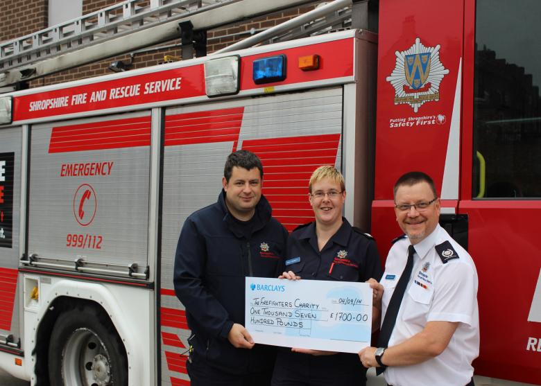 Sally presents cheque for Firefighters Charity