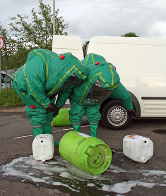 Firefighters in large weird-looking protective suits