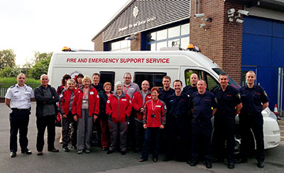 Group photo - staff standing in front of the van