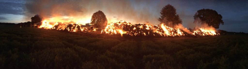 A field of straw ablaze at a Shropshire farm in the summer of 2016