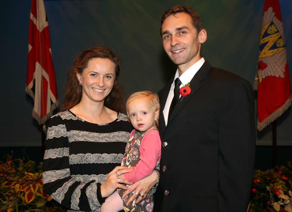 Martin Tomanek, from Slovakia, is now a Shropshire firefighter after settling in Cleobury Mortimer. He is pictured with wife Tanya and daughter Lorelei.