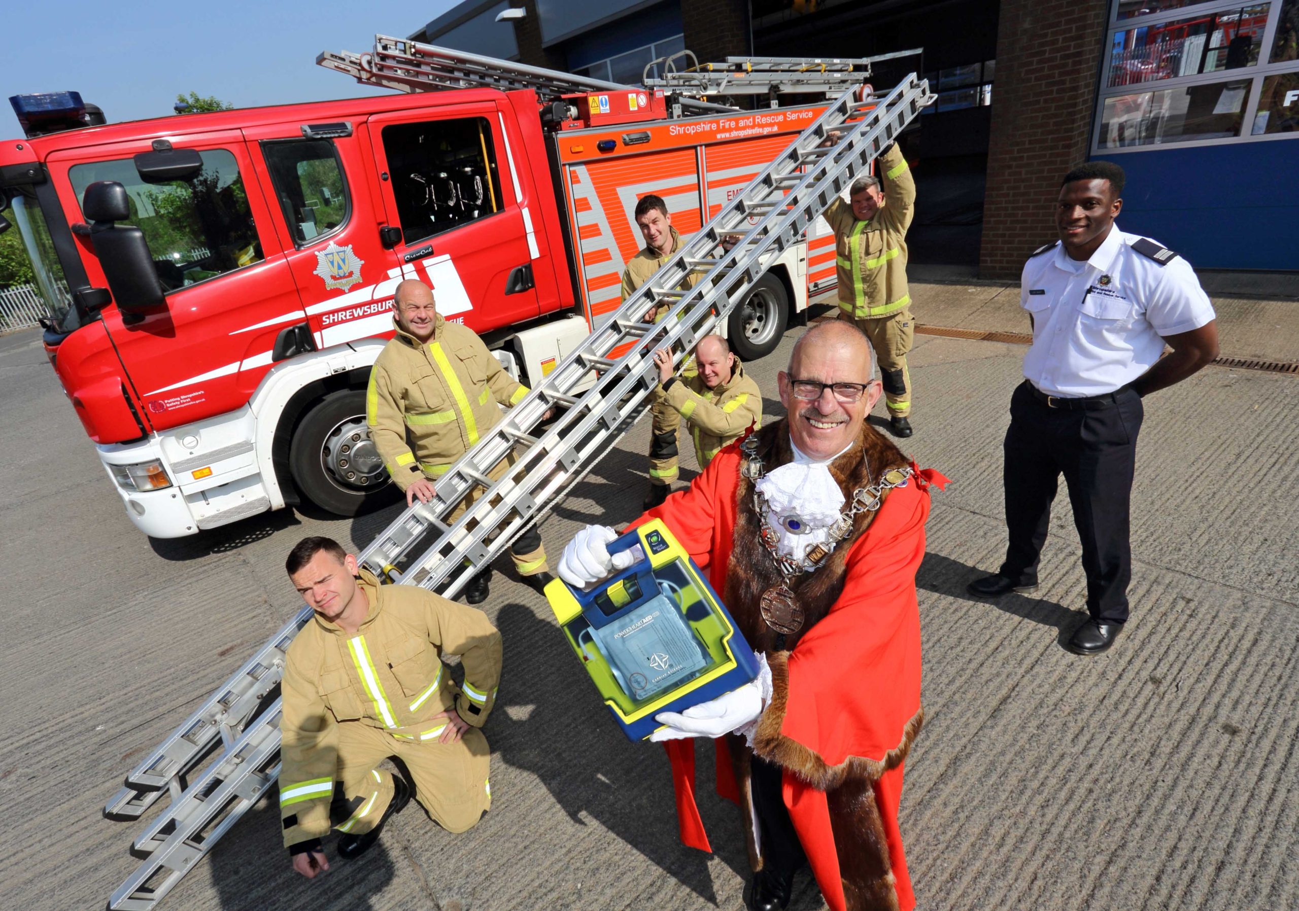 Firefighters from Red Watch Shrewsbury gave a lift to Shrewsbury Mayor’s defibrillators for schools appeal with their charity efforts to take a ladder to the top of Snowdon. L to R: Matt Dickenson, Graham Oliver, Lee Roberts, Steve Westley (kneeling), Kent Hallihan and Luke Grant, who all carried the ladder up Snowdon.