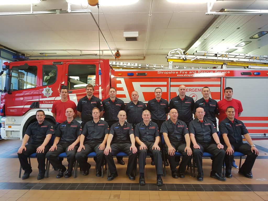 Oswestry Watch Manager John Davies (fourth from right front row) retires after a 33 year career as an on call firefighter. PIctured with the Oswestry crew.