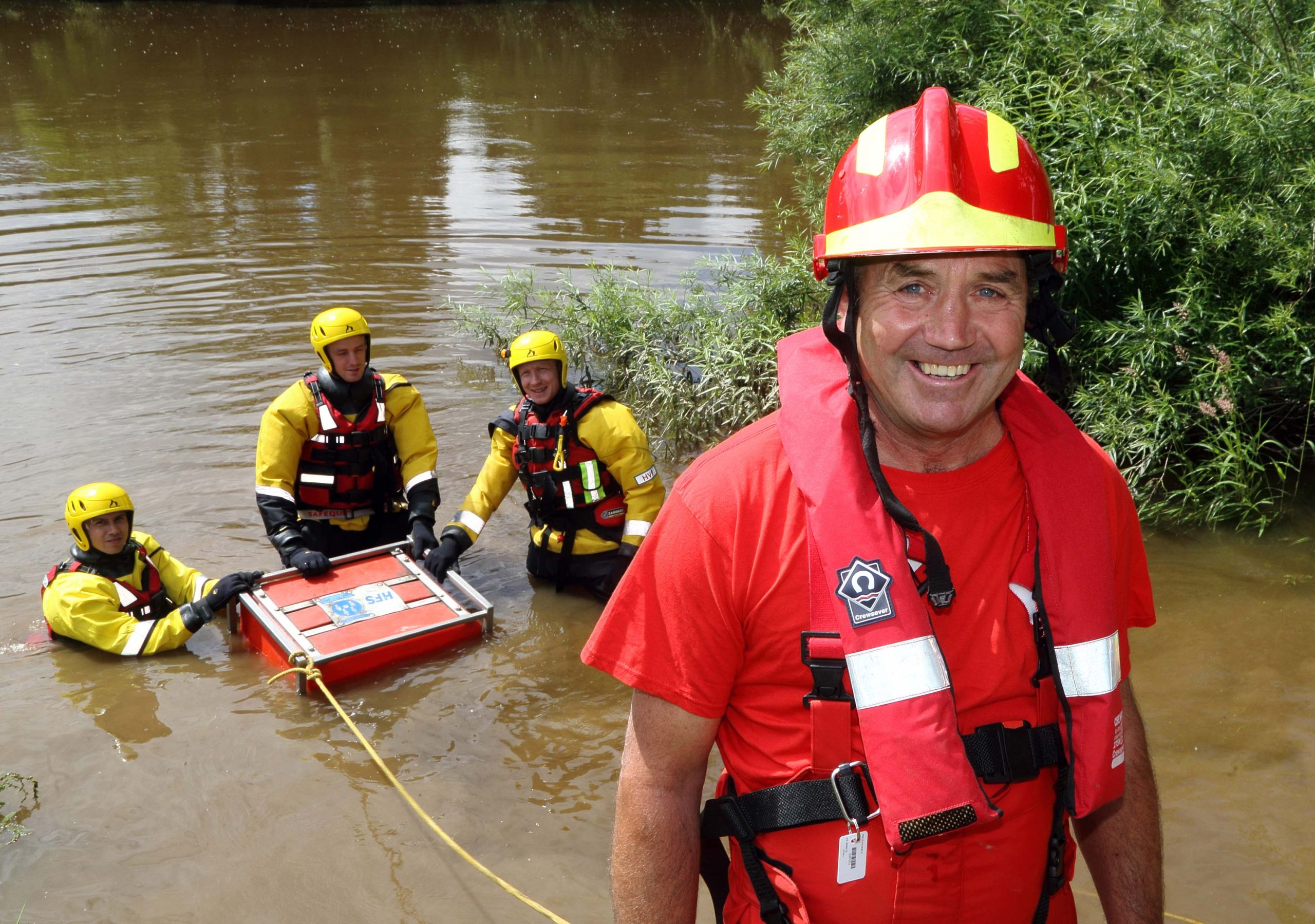 Tactical advisor Mac Harris with firefighters at the West Midlands showground by the River Severn in Shrewsbury, in training for the next floods disaster