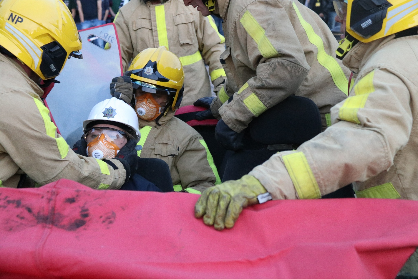 Amy is reassured by firefighters throughout her "rescue"