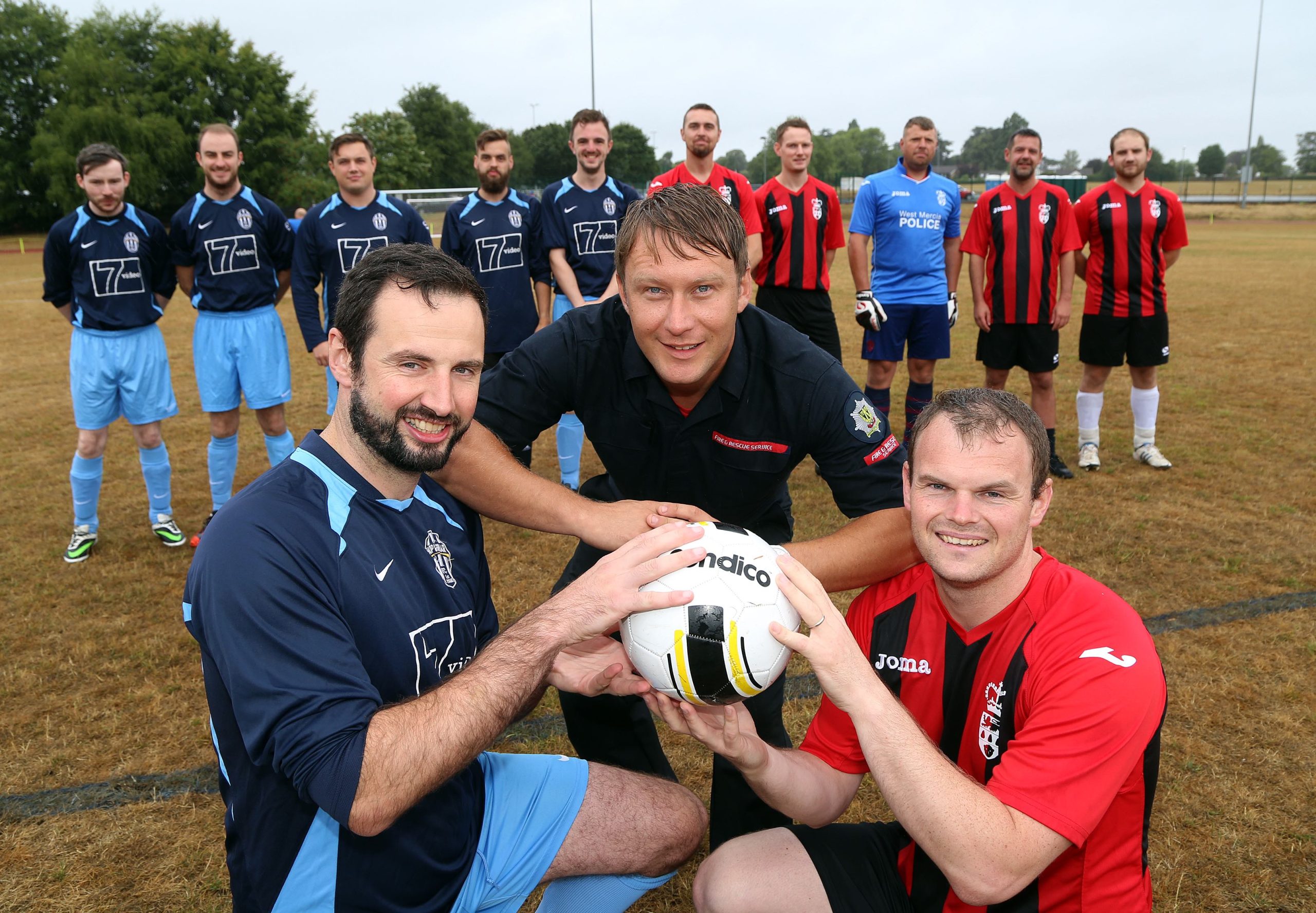 Police officer Jamie Adams with firefighter Andy Davies and Shropshire Council's Rob Jones at the football knockout competition won by the RAF team
